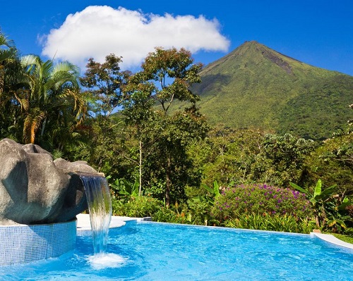 16565765 - pool with a view of the green side of arenal volcano, costa rica.